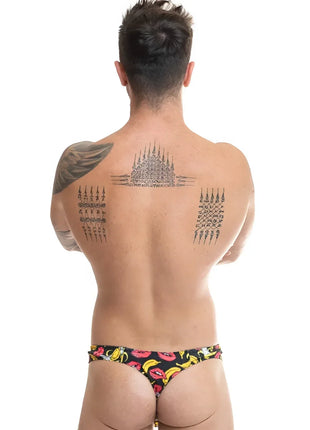 Schwarze anais men banana string badehose mit lebhaftem muster aus gelben bananen und pinken lippen