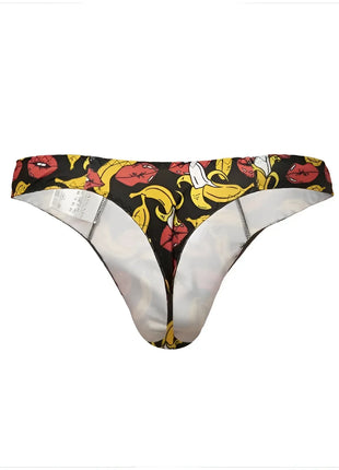 Schwarzer string anais men banana mit mutigem muster aus roten lippen und gelben bananen und weißem innenfutter
