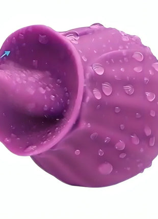 Armony fig-vibrator mit zunge aus lila silikon mit strukturierter oberfläche und wassertröpfchen