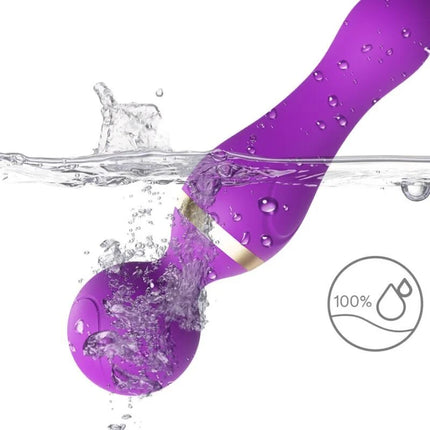 Armony freeza massager und vibrator lila silikon mit goldfarbener bandteil teilweise im wasser getaucht