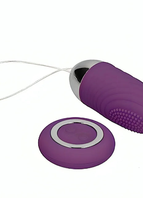 Violettes silikon vibrierendes ei mit silberner metallkappe und strukturierter griffigkeit mit fernbedienung