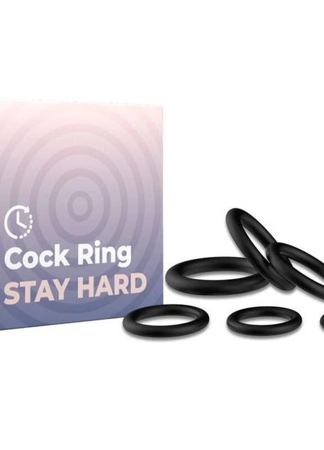 Schwarze silikon-cockringe in verschiedenen größen mit ARMONY-markenverpackung neben den ringen