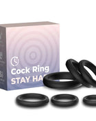 Black silikon cockringe in verschiedenen größen neben der arMony sicherungsringe silkon schwarz verpackung