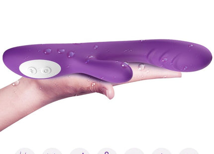Aromny spark vibrator wärmeeffekt lila silikon vibrator mit weißem bedienfeld und wassertropfen auf der oberfläche