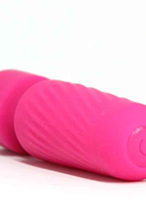 Hellrosa silikon vibrator mit geriffelter struktur und einschaltknopf ariony magic massager rosa