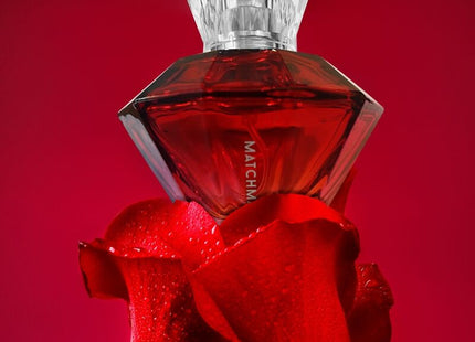 A red diamond-shaped pheromone perfume bottle auge der liebe matchmaker with faceted crystal stopper and match label