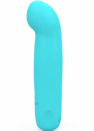 Ein eleganter, türkisfarbener bcute curve infinite classic silikon-vibrator von b swish mit geschwungener form
