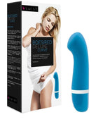 Blauer silikon bdesired deluxe curve vibrator mit weißem band nahe der basis von b swish