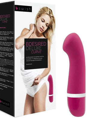 Ein lebhafter fuchsiasilikon-vibrator b swish bdesired deluxe curve rosa mit glatter, geschwungener form und weißem ring