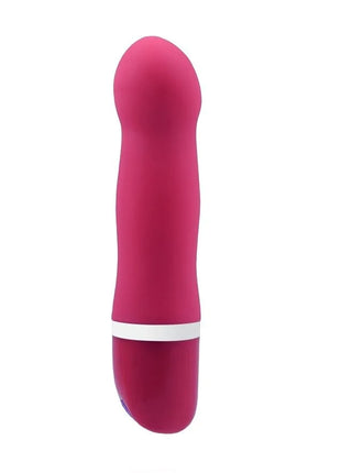 Ein schlanker, lebhafter pinkfarbener silikonvibrator b swish bdesired deluxe curve rosa mit weißem ring nahe der basis