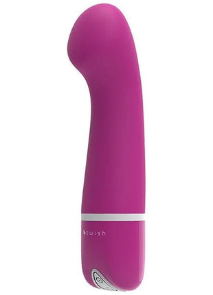 Ein elegantes magentafarbenes Erwachsenen-Spielzeug b swish bdesired deluxe curve rosa mit glatter gebogener form und weißem band nahe der basis