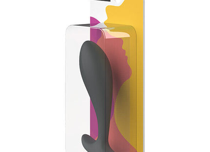 B swish bfille basic prostatic plug slate aus schwarzem silikon in transparenter verpackung mit buntem abstraktem hintergrund