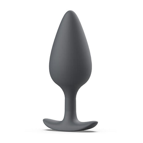 Ein schlanker, matter grauer silikon-prostatastecker b swish bfilled basic plus mit glattem, konischem design und stabilem grundfuß