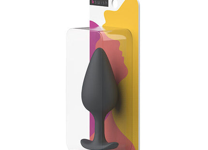 Schwarzer silikon-prostataplug b swish bifilled basic plus im klaren plastikverpackung mit buntem abstraktem design