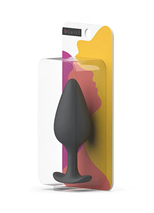 Schwarzer silikon-prostataplug b swish bifilled basic plus im klaren plastikverpackung mit buntem abstraktem design