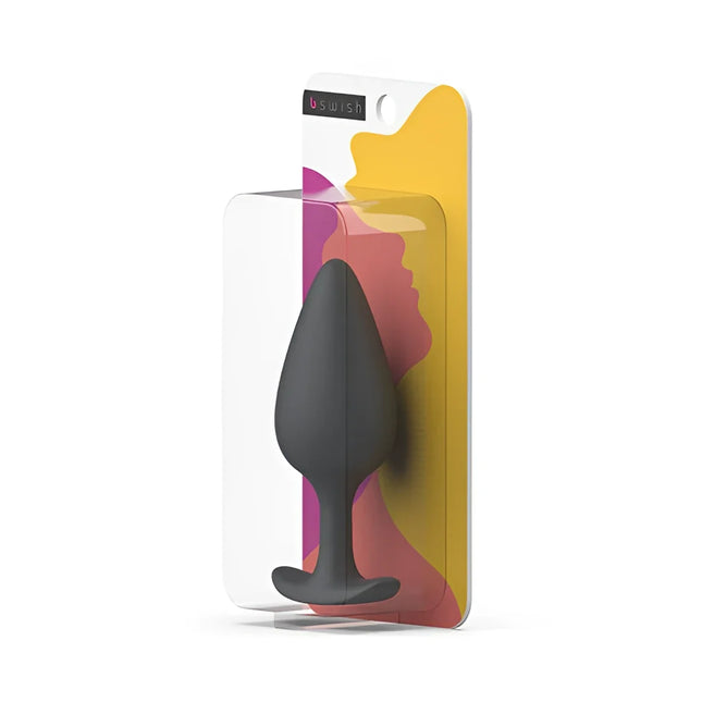 Schwarzer silikon-prostataplug b swish bifilled basic plus im klaren plastikverpackung mit buntem abstraktem design