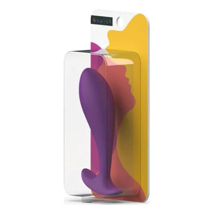 Lila silikon-prostatstecker b swish bfille basic in transparenter verpackung vor buntem abstraktem hintergrund