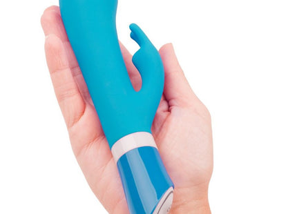 Teal silikon rabbit-vibrator mit glänzendem blauem boden und weißen steuerungstasten bwish bwild deluxe bunny rabbit vibrator jade