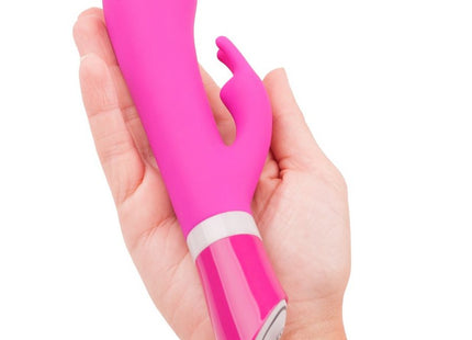 Vibrante pinke silikon vibrator in hasenform mit glänzendem finish und weißem akzentband b swish bwild deluxe bunny rabbit raspberry