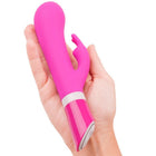 Vibrante pinke silikon vibrator in hasenform mit glänzendem finish und weißem akzentband b swish bwild deluxe bunny rabbit raspberry