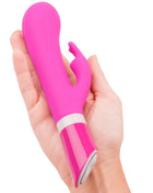 Vibrante pinke silikon vibrator in hasenform mit glänzendem finish und weißem akzentband b swish bwild deluxe bunny rabbit raspberry