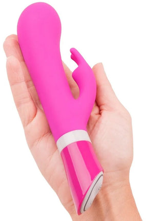 Vibrante pinke silikon vibrator in hasenform mit glänzendem finish und weißem akzentband b swish bwild deluxe bunny rabbit raspberry