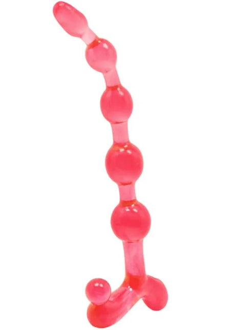 Ein transparenter rosa silikon analplug mit einer reihe abgerundeter perlen und einem breiten stützfuß von baile bendy twist rote analblle