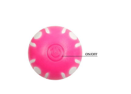 Ein leuchtend pinker kugelförmiger elektronischer ball mit weißen blütenblattmustern und zentralem power-knopf für baile rosa g-spot 21,8 cm
