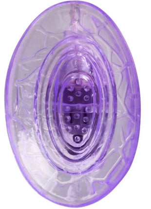 Lila vibrierender klitorisstimulator von baile mit ovaler transparenter form und texturierter oberfläche