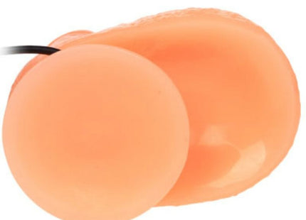Peachfarbene silikon ohrstöpsel mit schwarzer schnur neben baile penis vibrations dildo mit realistischem vibrationsempfinden