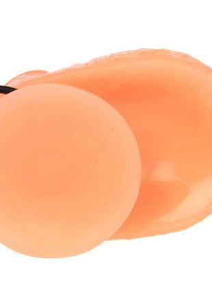 Peachfarbene silikon ohrstöpsel mit schwarzer schnur neben baile penis vibrations dildo mit realistischem vibrationsempfinden