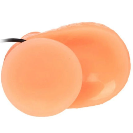 Peachfarbene silikon ohrstöpsel mit schwarzer schnur neben baile penis vibrations dildo mit realistischem vibrationsempfinden