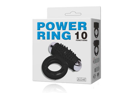 Schwarzer silikon power ring mit silbernen metallkugeln und geriffelter oberfläche verpackt in weißer box power ring 10 funktionen von baile