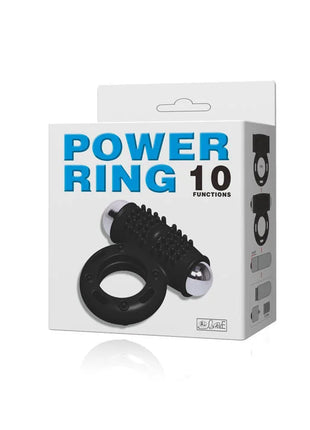 Schwarzer silikon power ring mit silbernen metallkugeln und geriffelter oberfläche verpackt in weißer box power ring 10 funktionen von baile