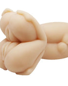 Beige silikon babyfigur mit glatten rundungen und detailreichen gesichtszügen für lady masturbator dreier