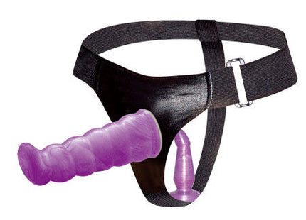 Lila texturierter dildo mit silberner schnalle an schwarzem lederähnlichem anal und vaginalgeschirr von baile