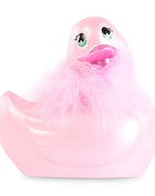 Ein rosa gummienten-plüschspielzeug big tease toys i rub my my duckie 2.0 mit grünen augen und flauschigem kragen