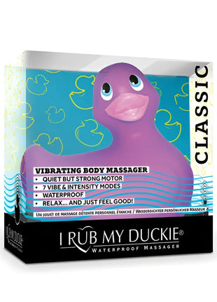 Lila gummi-enten-vibrationskörpermassagegerät i rub my duckie classic mit pinkem schnabel und blauen augen