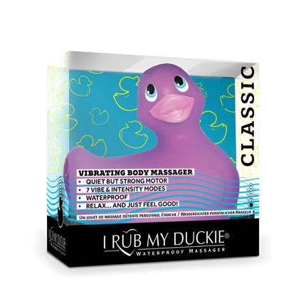 Lila gummi-enten-vibrationskörpermassagegerät i rub my duckie classic mit pinkem schnabel und blauen augen