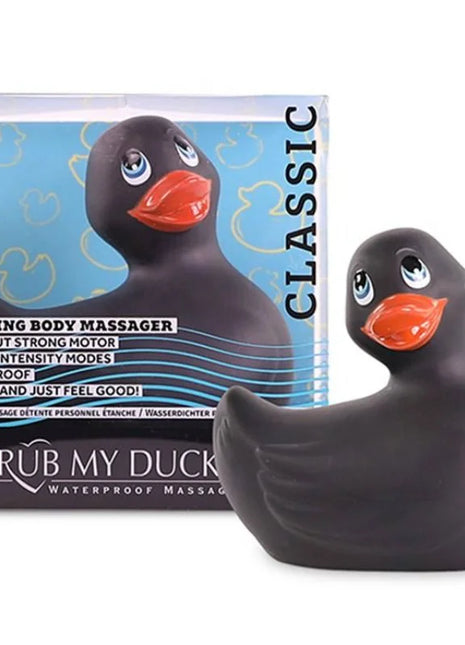 Schwarzer vibrierender badeente massager mit orangefarbenem schnabel und blauen augen von big tease toys