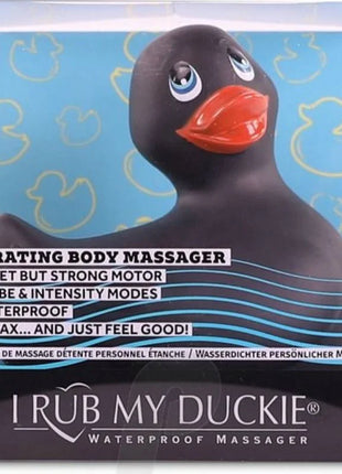 Schwarzer gummiente vibrierender körpermassagegerät mit orangeem schnabel und blauen augen von i rub my duckie classic