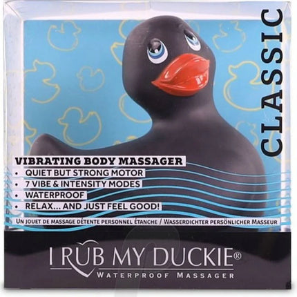 Schwarzer gummiente vibrierender körpermassagegerät mit orangeem schnabel und blauen augen von i rub my duckie classic