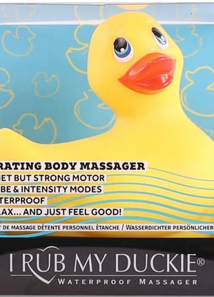 Gelber gummi-entenförmiger vibrierender körpermassagegerät mit rotem schnabel und blauen augen von i rub my duckie classic