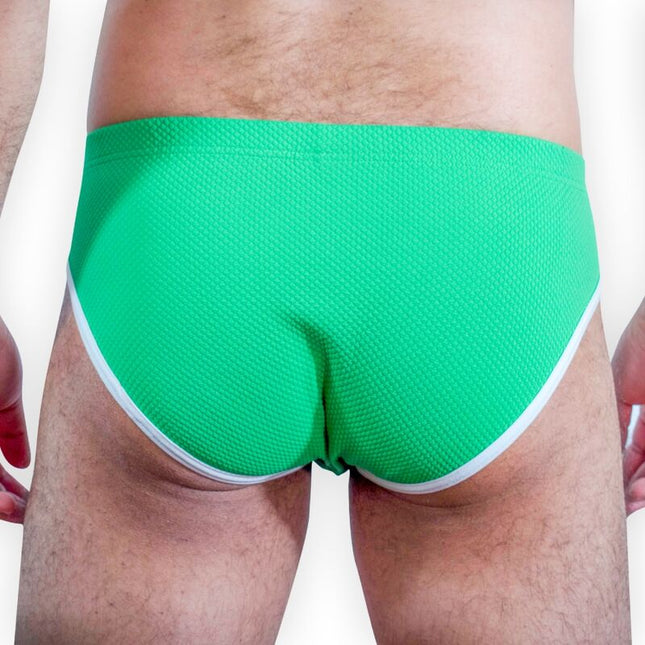 Hellegrüne strukturierte badehose burn 022 green slip s mit weißem besatz vorne sichtbar
