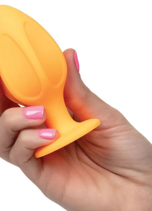 Klarer orangefarbener silikon-analplug mit ergonomischem design und strukturierter griffoberfläche von calexotics