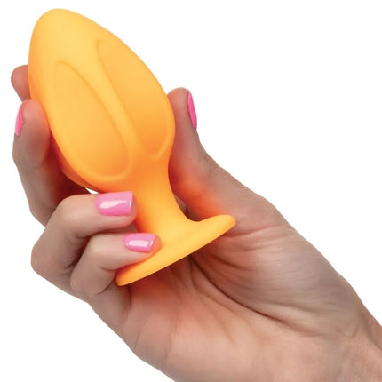 Klarer orangefarbener silikon-analplug mit ergonomischem design und strukturierter griffoberfläche von calexotics