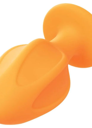 Orizontal orange silikon analstecker mit glattem rundem design und saugnapf am fuß von calexotics