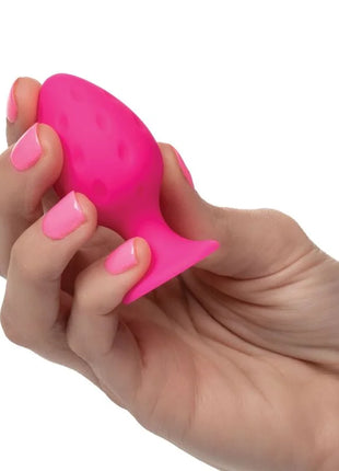 CaleXotics cheeky buttplug rosa ein lebhafter rosa silikon vaginaldilator mit strukturierter rundlicher spitze und breiter basis