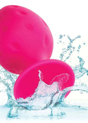 Vibrant pink egg-shaped water-resistant toy made of smooth textured material called CalExotics Cheeky Buttplug Rosa