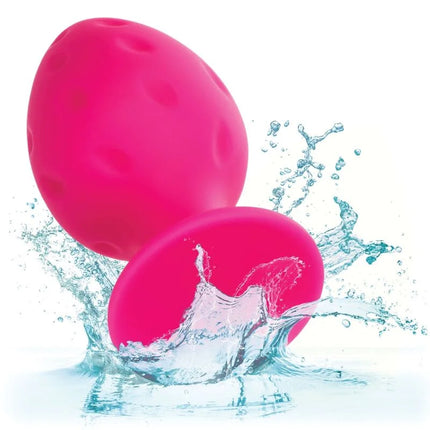 Vibrant pink egg-shaped water-resistant toy made of smooth textured material called CalExotics Cheeky Buttplug Rosa